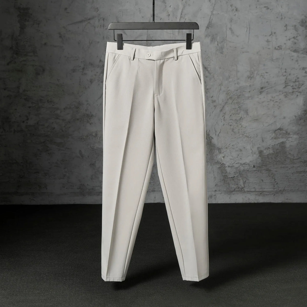 Men's straight loose trousers in light gray brushed polyester, front view showing straight cut and elastic waist