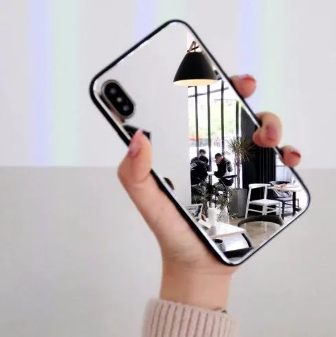 Black iPhone mirror phone case showing reflective surface, compatible with iPhone X and 7/8 Plus models.