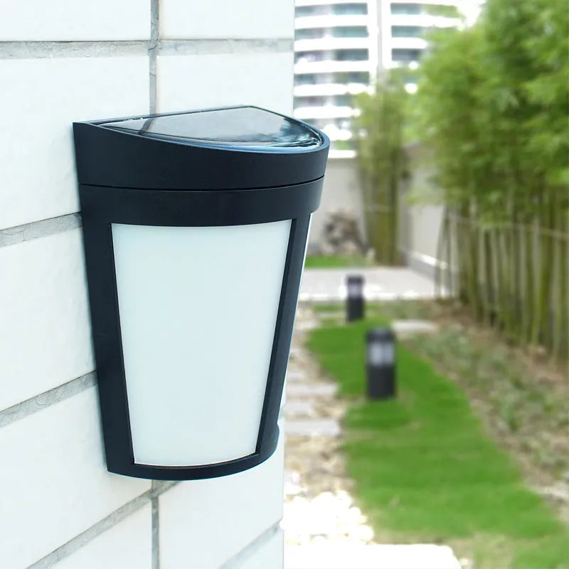 Solar-powered outdoor wall lamp with six LEDs and IP65 waterproof rating for garden and courtyard lighting