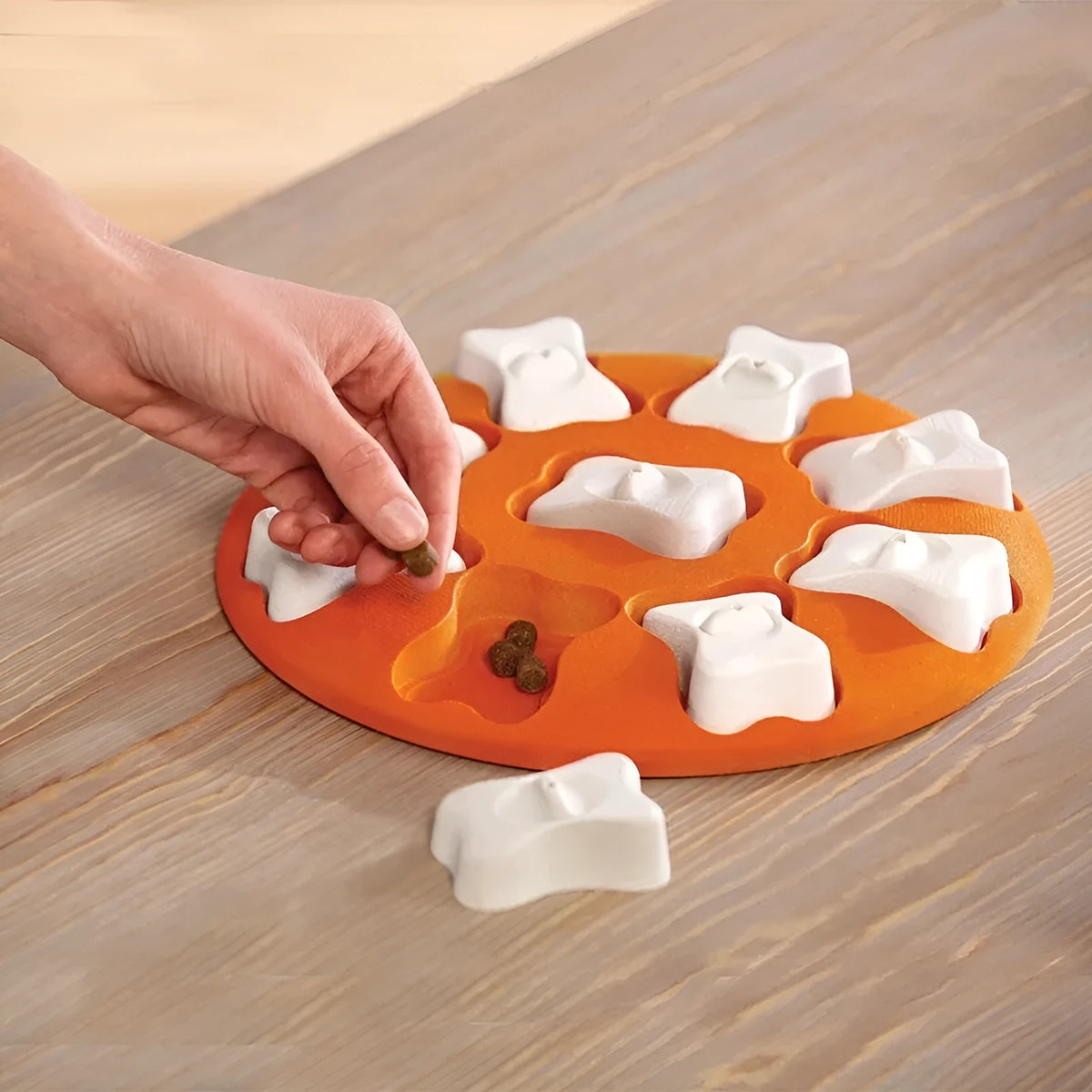 Orange and white plastic leak food toy for pets, interactive treat dispenser for dogs and cats