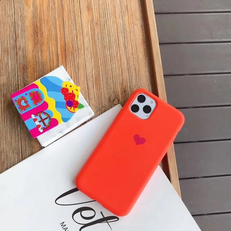 Solid-colour silicone iPhone case shown in multiple colour options