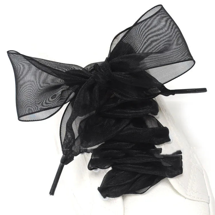 Flat, wide transparent lace shoelaces in multiple colour options on a white background.