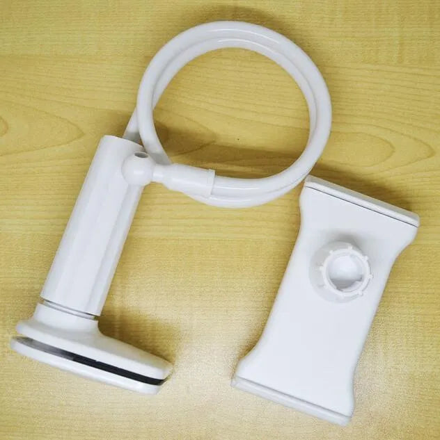 Black aluminium alloy and plastic bedside phone handset with long arm extended on a wooden table.