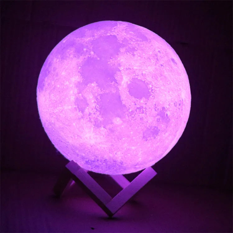 3D printed white moon lamp on a wooden stand with touch-control ring at base