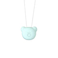 Small pink wearable USB air purifier necklace on a person, showing compact size.