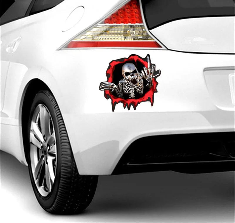 Colourful reflective metal skull bumper sticker on a car bumper.