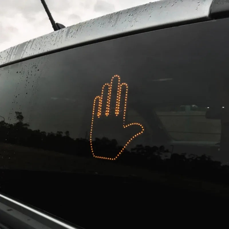 Black plastic LED car gesture light showing middle finger gesture with remote control