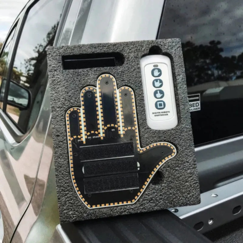 Black plastic LED car gesture light showing middle finger gesture with remote control