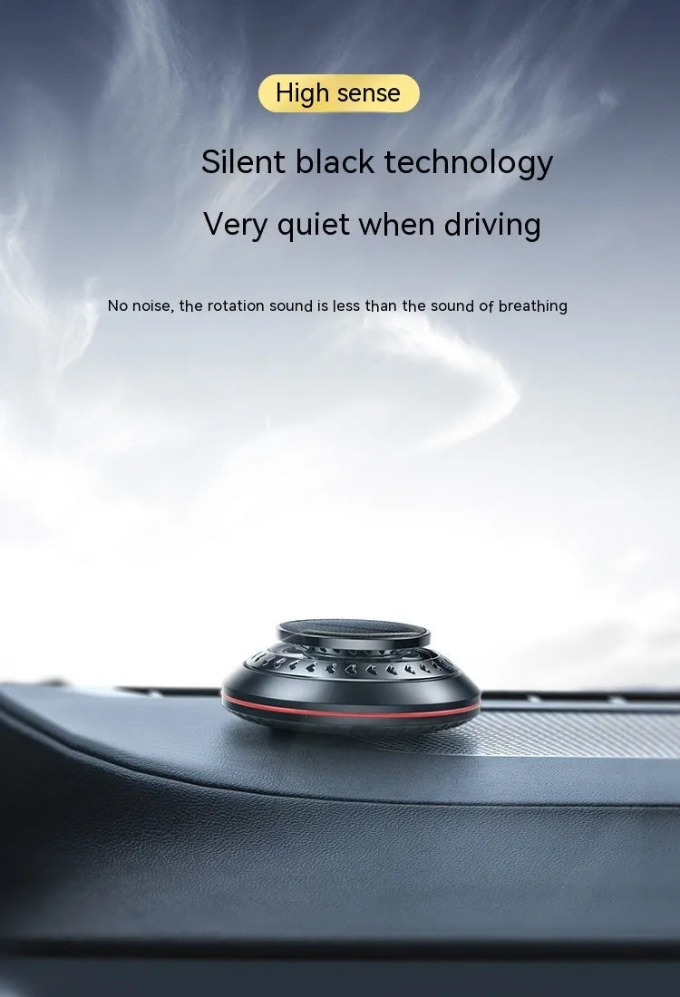 Solar-powered aluminium car air purifier and essential oil diffuser unit on a car dashboard