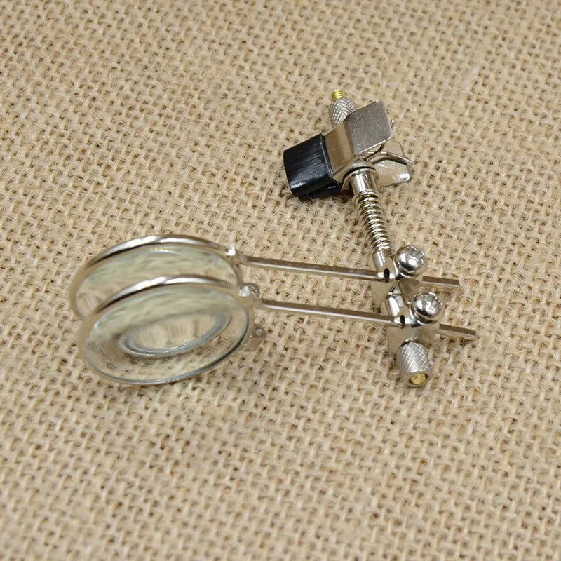 Metal frame auxiliary reading glasses with a double clip design for attaching over existing eyewear.