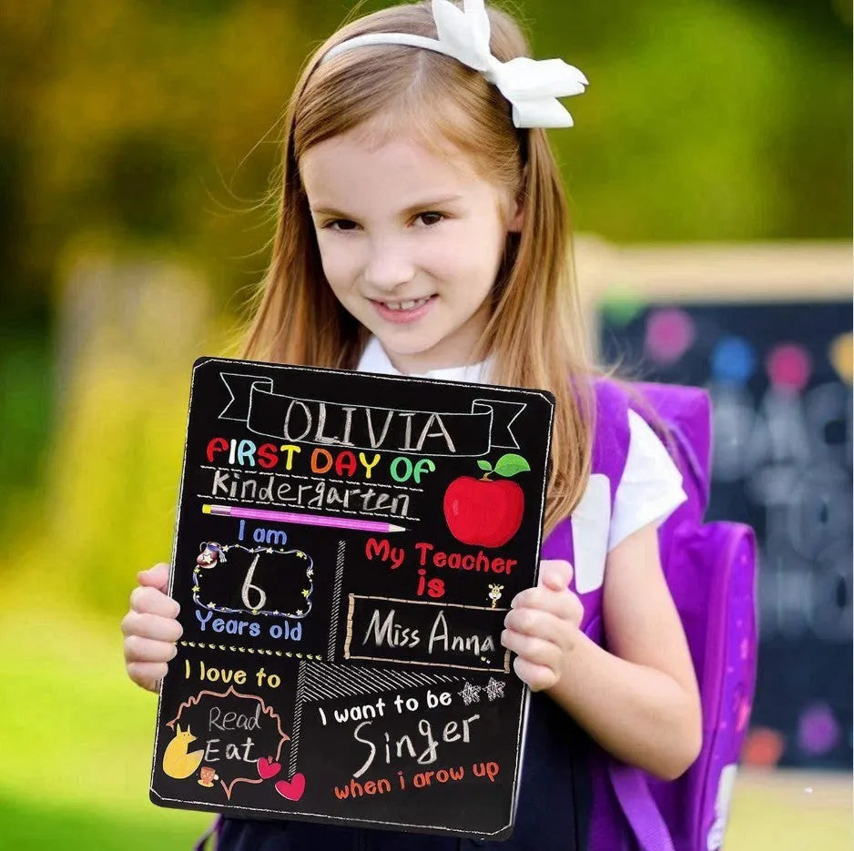 Black wooden First Day of School blackboard sign measuring 255mm by 300mm