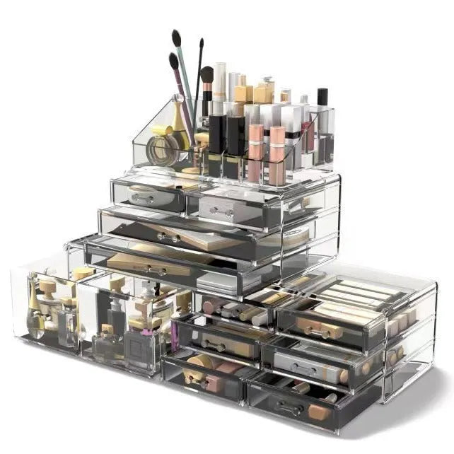Acrylic three-layer cosmetics storage box in transparent finish with organised compartments on a dressing table