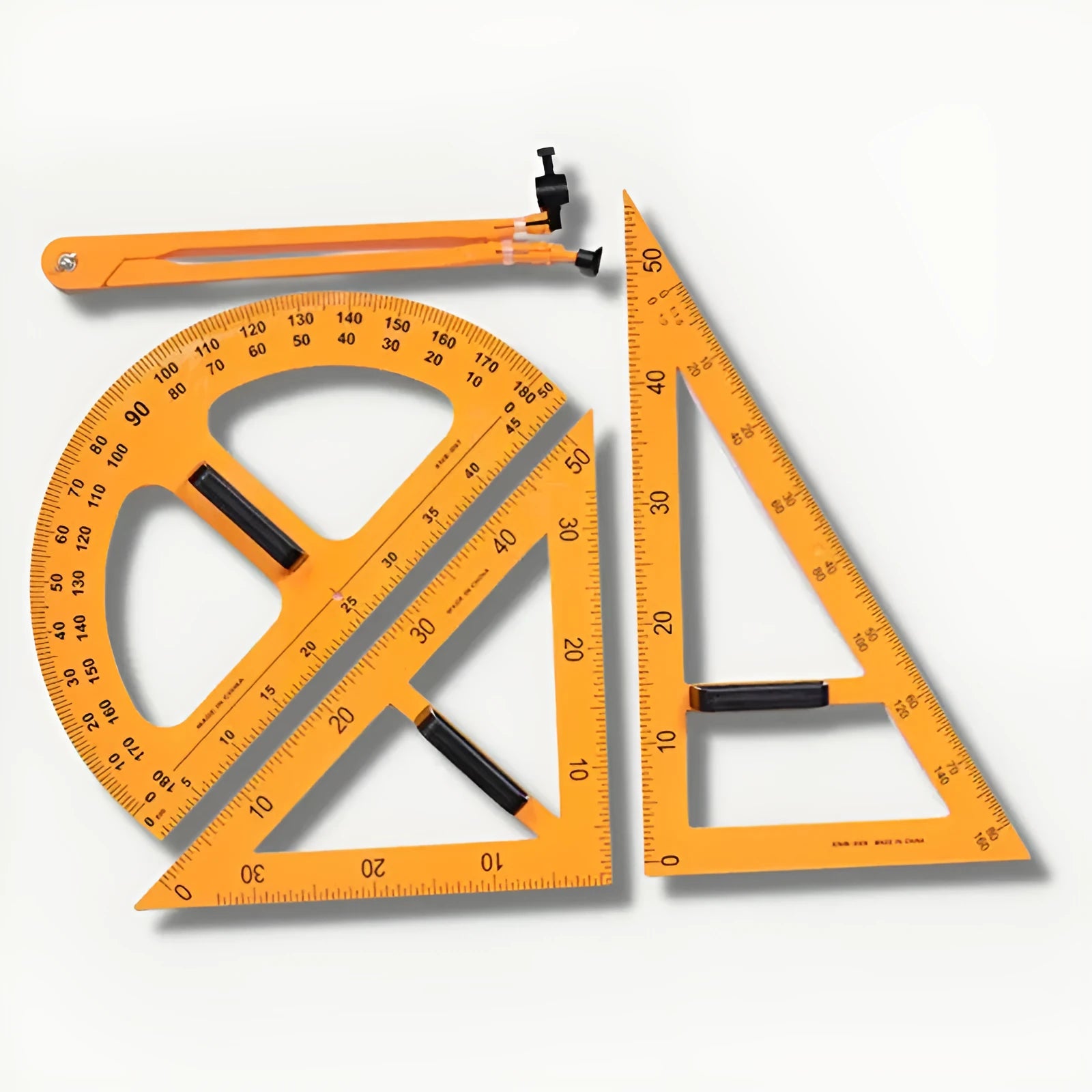 Orange and black plastic mathematics teaching set with triangle rulers, protractor and chalk compass