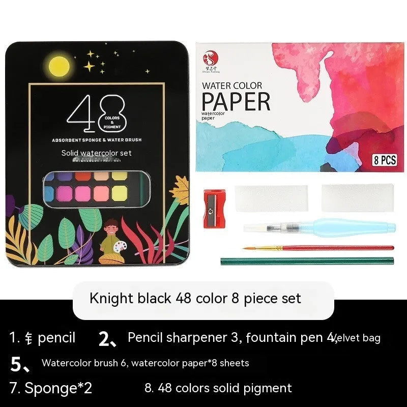 Box of 48 solid watercolour paint cakes showing colours including Black Knight, Girl Pink, and Sunshine Blue.