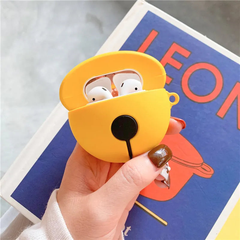 Yellow silicone AirPods case with a small silver bell charm attached