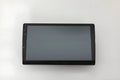 Black 10.1 inch universal Android car head unit with touch screen display on a trapezoidal panel