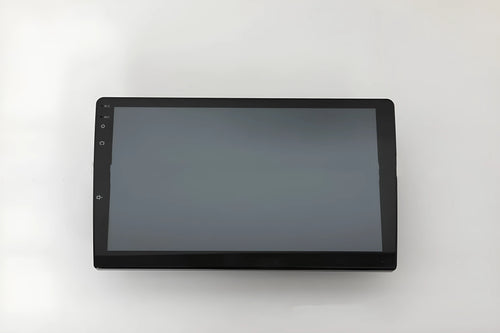 Black 10.1 inch universal Android car head unit with touch screen display on a trapezoidal panel