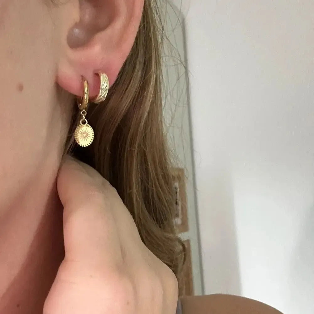 Silver geometric ellipse stud earrings for women made from stainless steel.