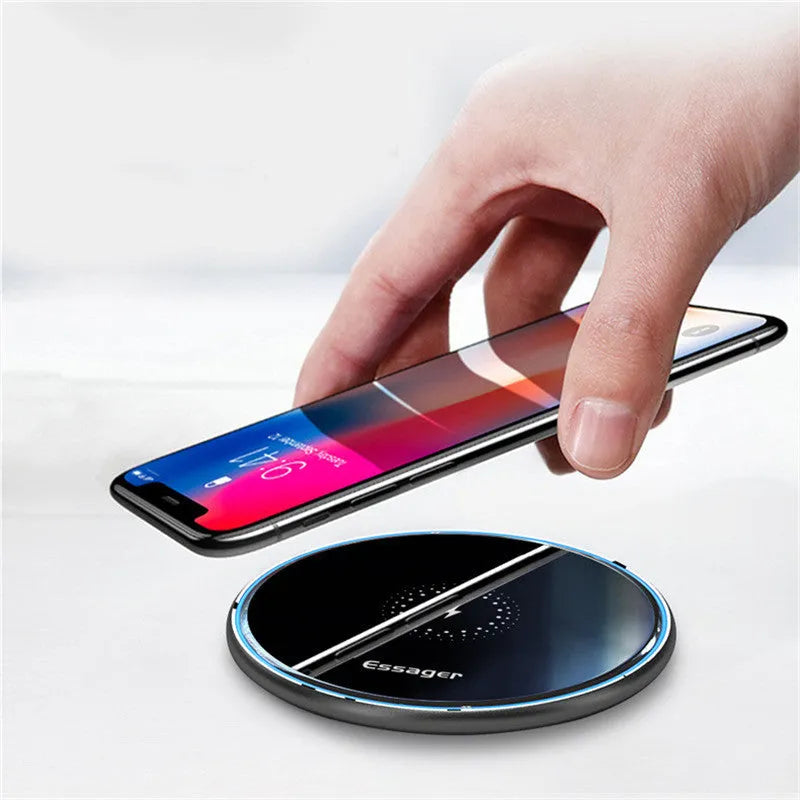 Black wireless charging pad with LED indicator light for phones and headphones