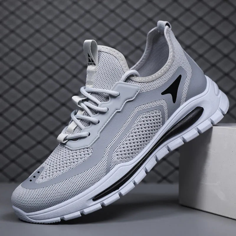 Men's fly knit mesh sneakers with front lace-up, flat rubber sole, round toe, and sequin detail, in beige