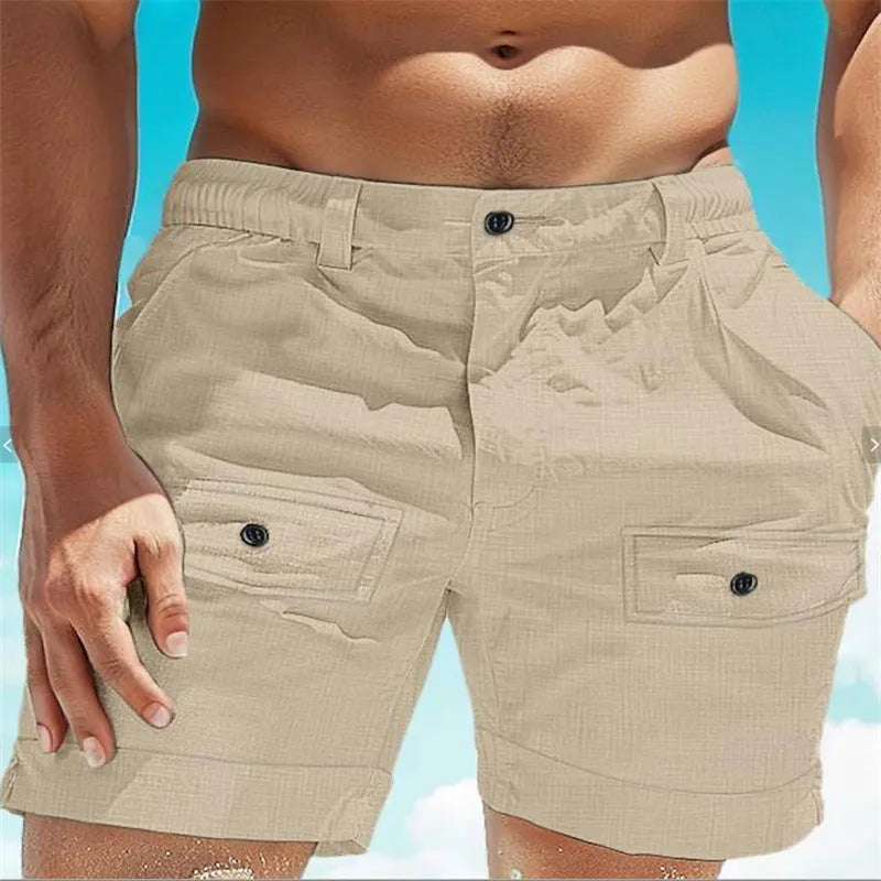Men's khaki linen shorts with button front and elastic waistband laid flat