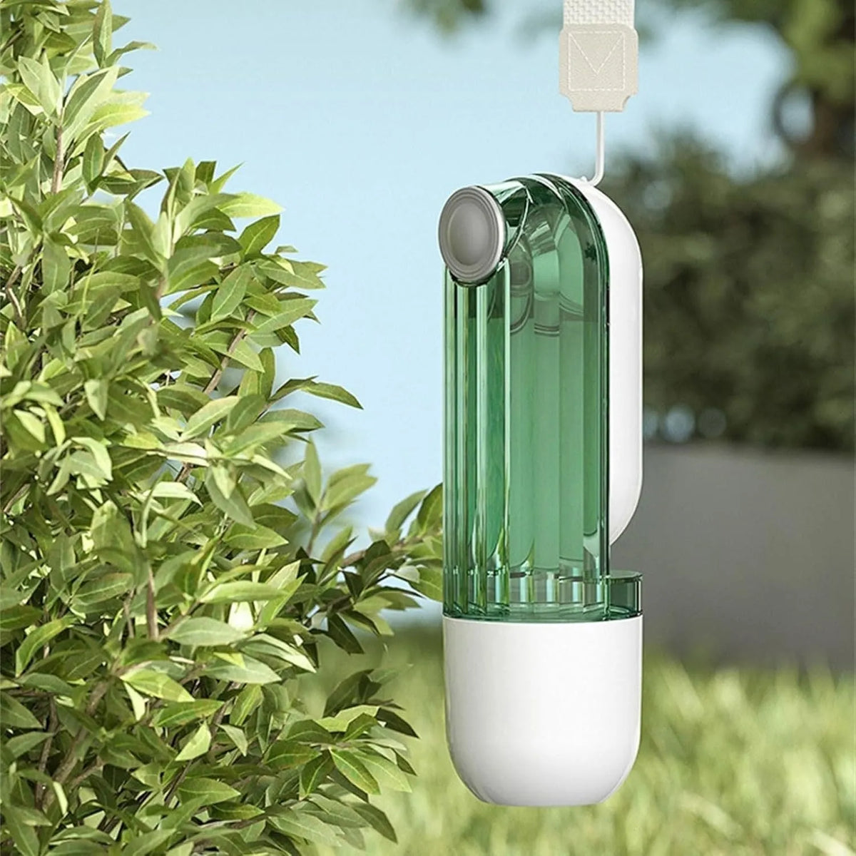 Beige foldable dog water bottle with food dispenser shown next to a dog on a walk