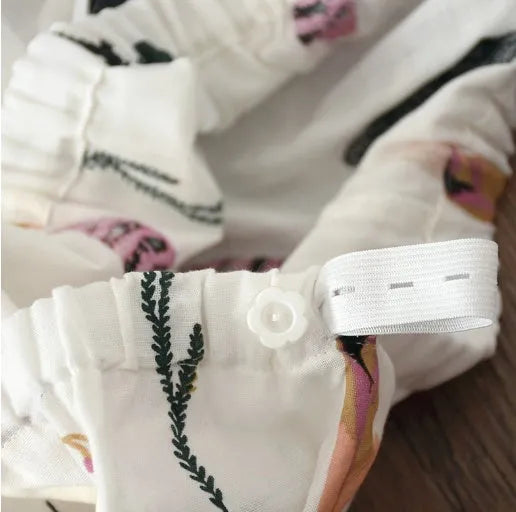 Traditional polyester maternity pajama set with turn-down collar, full bell sleeves, and ankle-length trousers in solid natural colour
