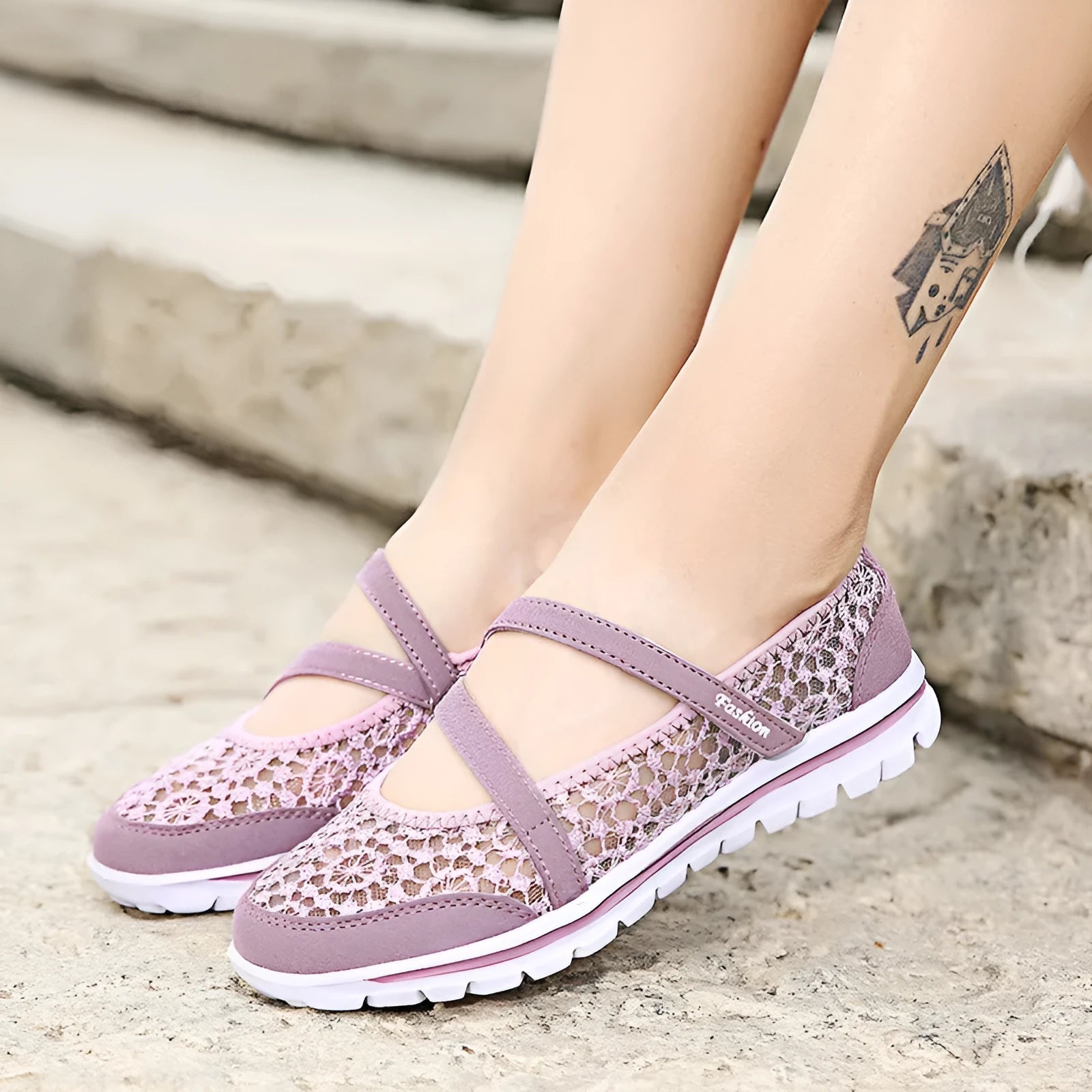 Women's flat lace-up casual shoes with mesh upper in beige, shown from the side.