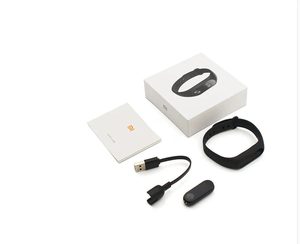 Black Xiaomi Mi Band 2 smartband with OLED screen on an adjustable thermoplastic wrist strap.