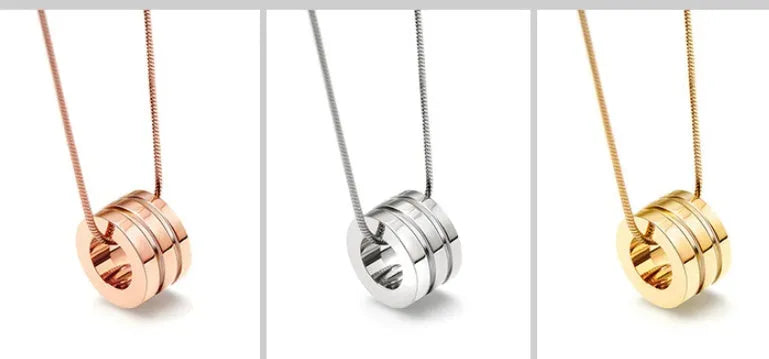Screwdriver pendant necklace in titanium steel with 18K gold plating, shown in gold, rose gold, and steel colour at 45cm or 50cm.