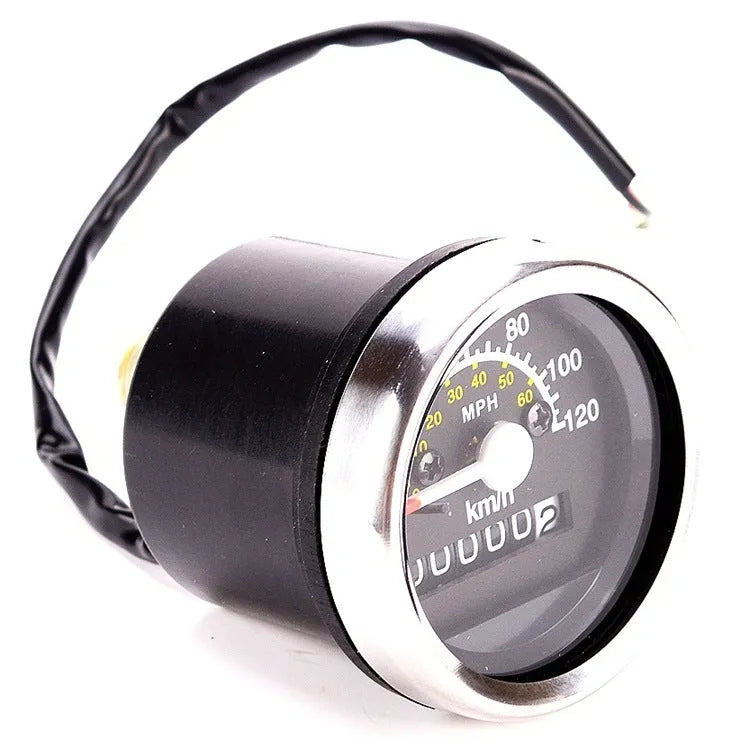 Black round motorcycle mechanical speedometer with dual kilometer and mile scales, 61.5mm diameter, 12V