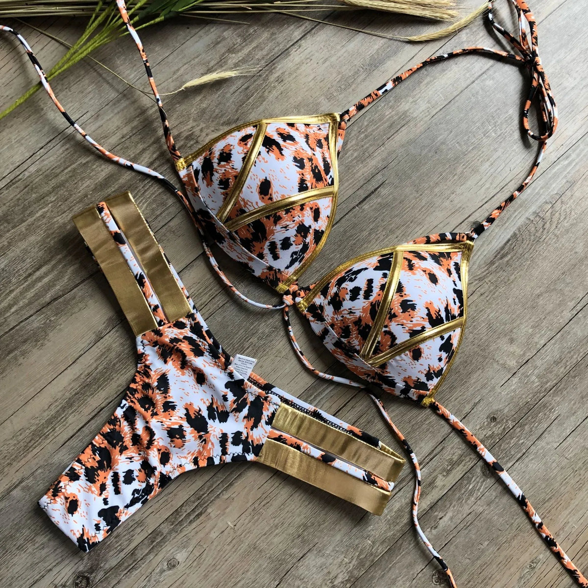 Women's bronzing bikini swimsuit in nylon with cotton lining and chest pads.