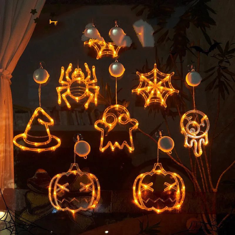 Halloween window hanging LED lights with spider and pumpkin decorations creating horror atmosphere lighting
