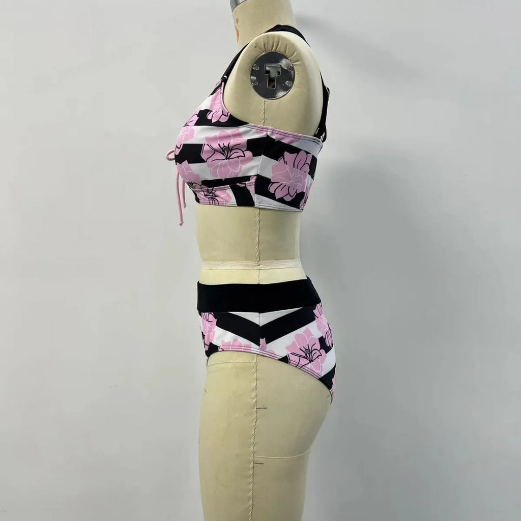 Black women's bikini with covered belly and split style for swimming.