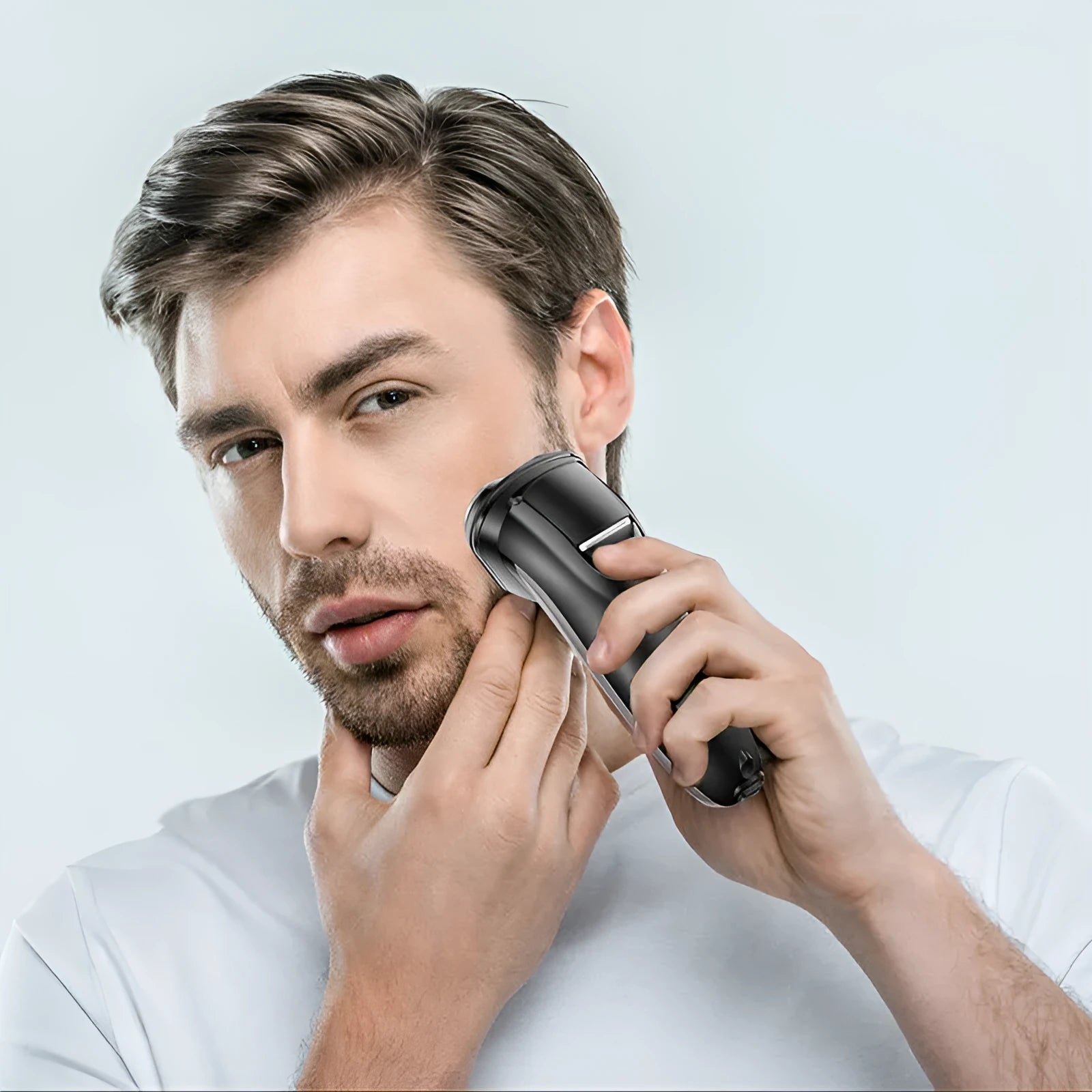 Rechargeable electric shaver for men with three floating heads and a pop-up sideburn trimmer on a stand.