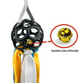 Interactive hollow TPR bell toy ball for dogs and cats in green colour on a surface