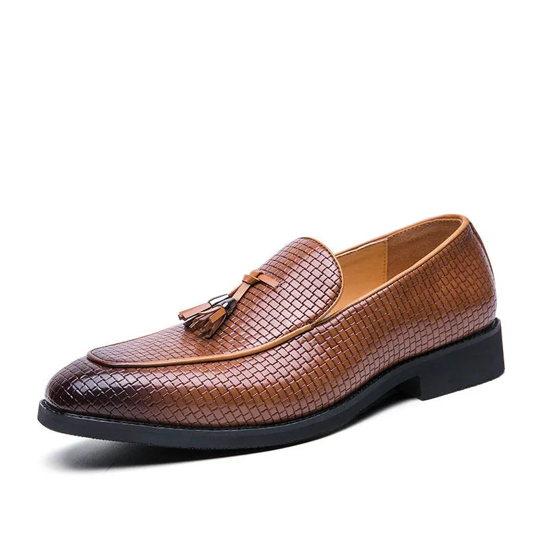 Men's black pointed toe slip-on shoes with a tassel detail on the low-top PU leather upper.
