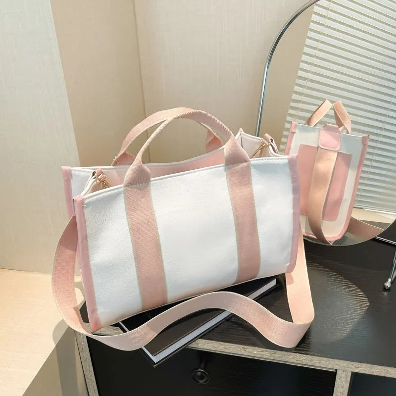 Women's canvas tote bag in horizontal square shape with open pocket, available in black