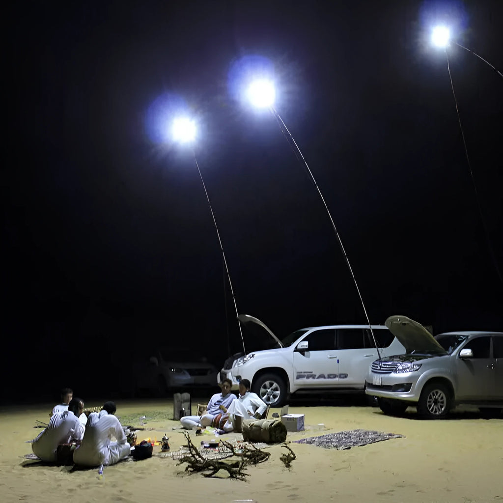 White LED fishing rod light mounted on a telescopic pole with remote control for outdoor use.