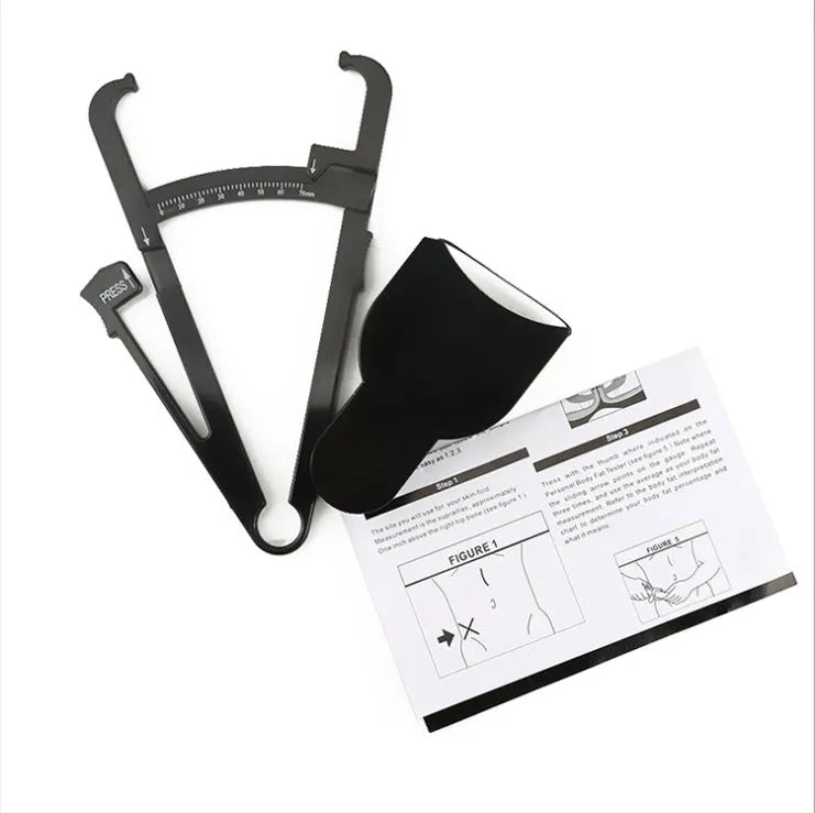 Black ABS plastic body fat caliper with measurement scale and included flexible measuring tape.