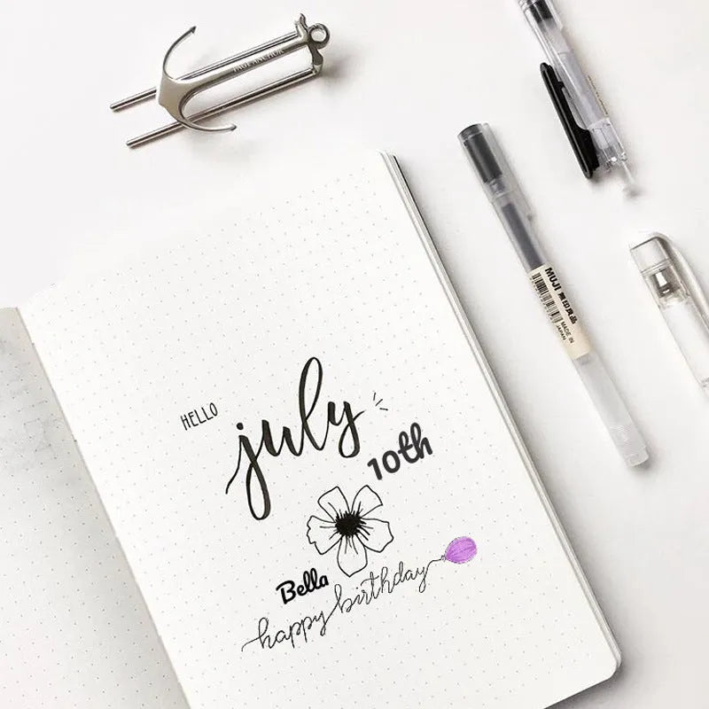 A5 dotted notebook with imitation leather cover in blue or pink, 100gsm dot grid paper and locking plastic binding