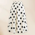 Women's black one-piece swimsuit with attached round skirt and decorative bow detail