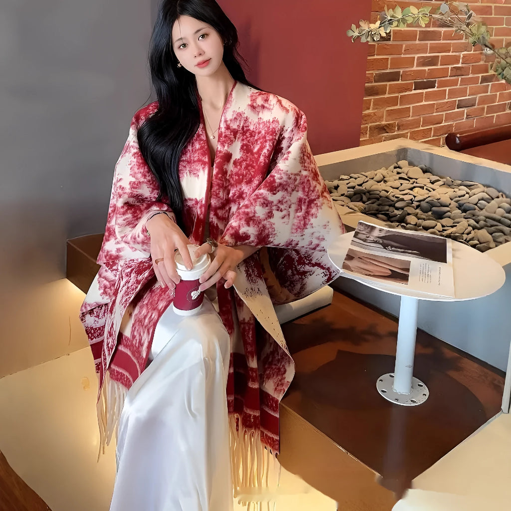 Women's polyester scarf cape with tassels in a choice of five colours, worn as a shawl.