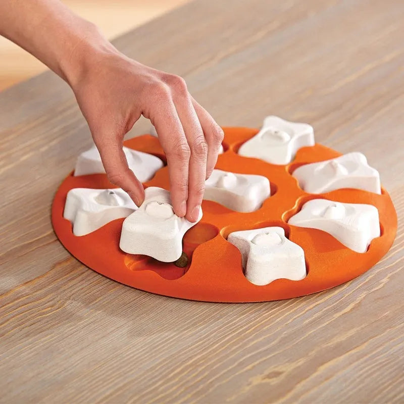 Orange and white plastic leak food toy for pets, interactive treat dispenser for dogs and cats