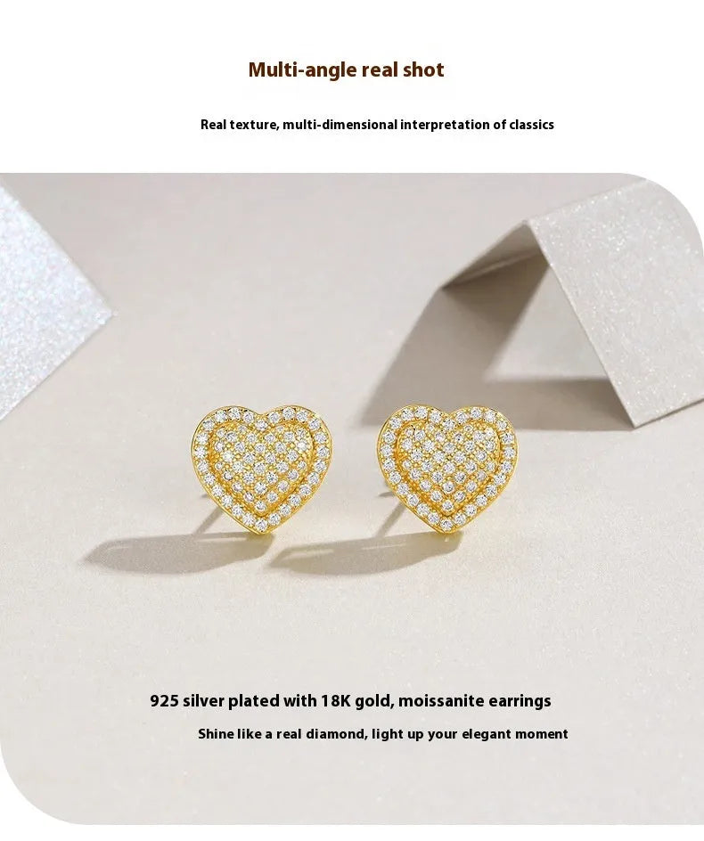 Golden heart-shaped moissanite stud earrings on a 925 sterling silver post.