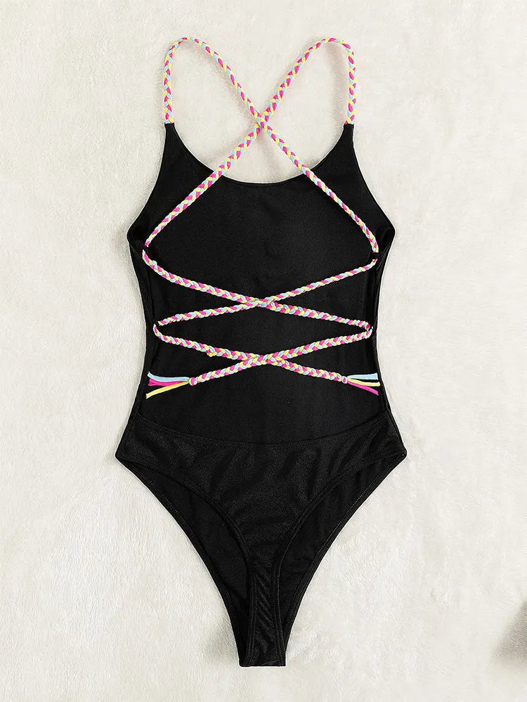 Black backless one-piece swimsuit with sleeveless design, made from nylon fabric
