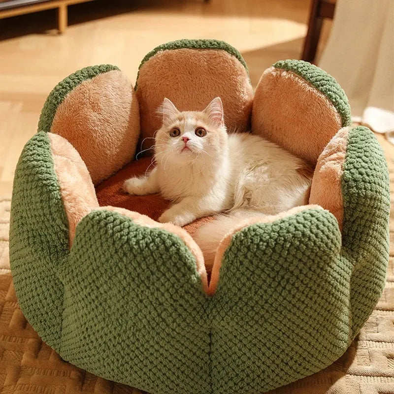 Green cactus petal-shaped soft plush pet bed for cat or dog on a hardwood floor.