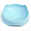 Blue ceramic dog slow feeder bowl with internal maze pattern for small, medium, and large breed puppies.