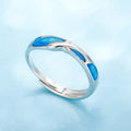 Silver adjustable couple ring with dolphin motif simple style on surface