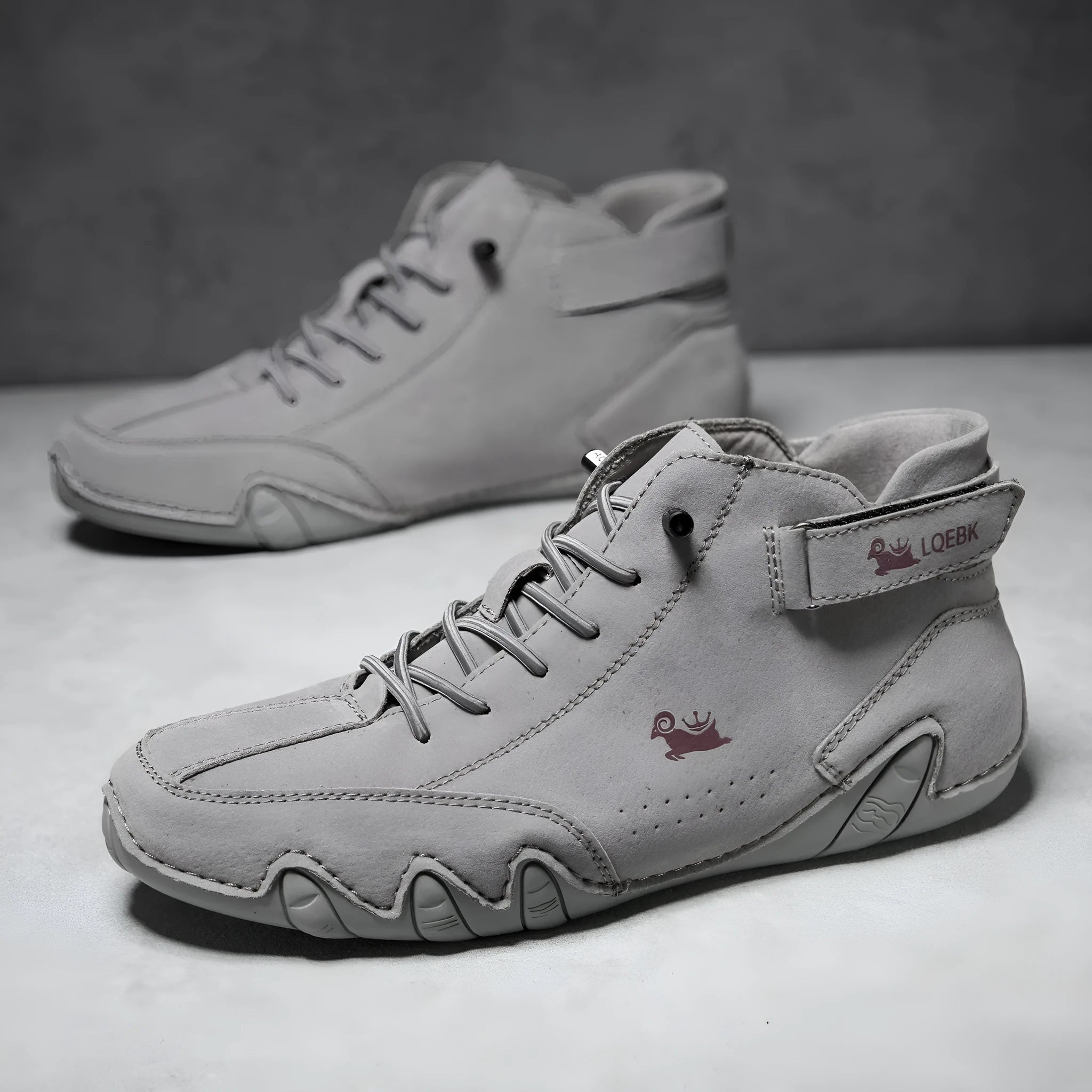 Men's brown high-top Martin boots with round toe and flat rubber sole on a white background.